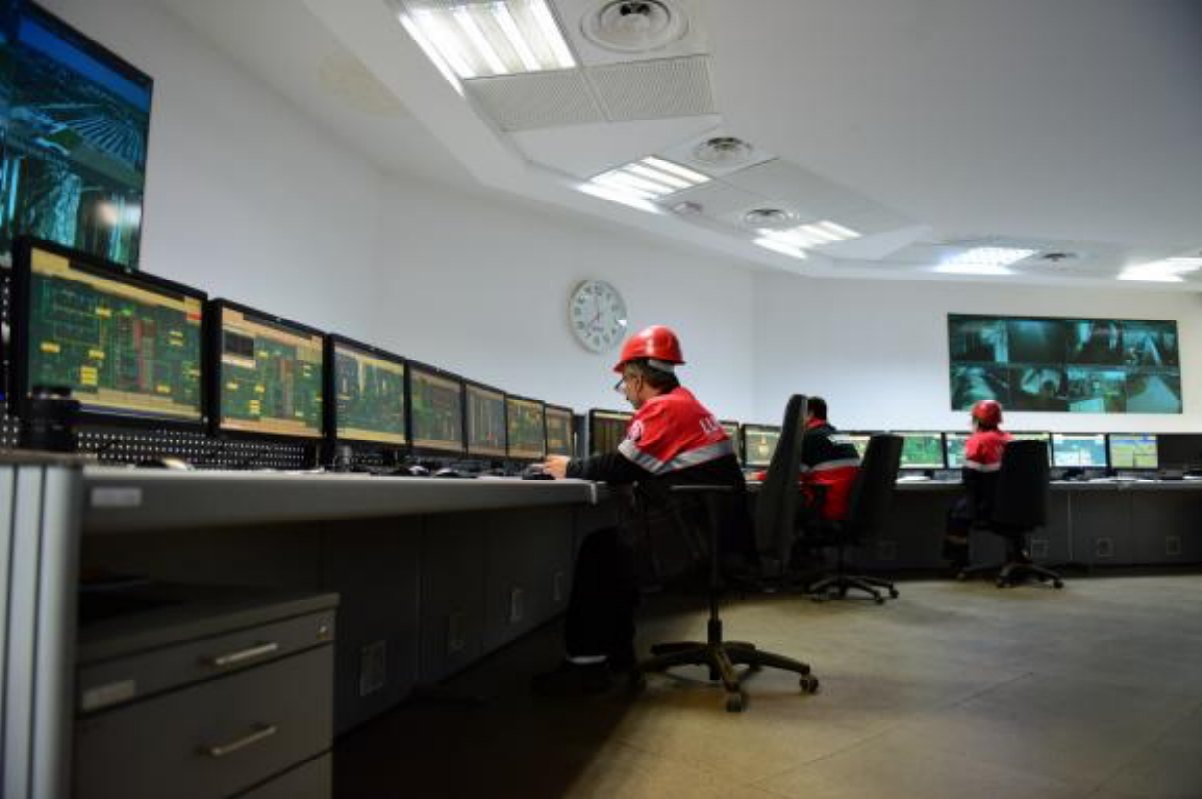 Power plant control room with operators at the consoles